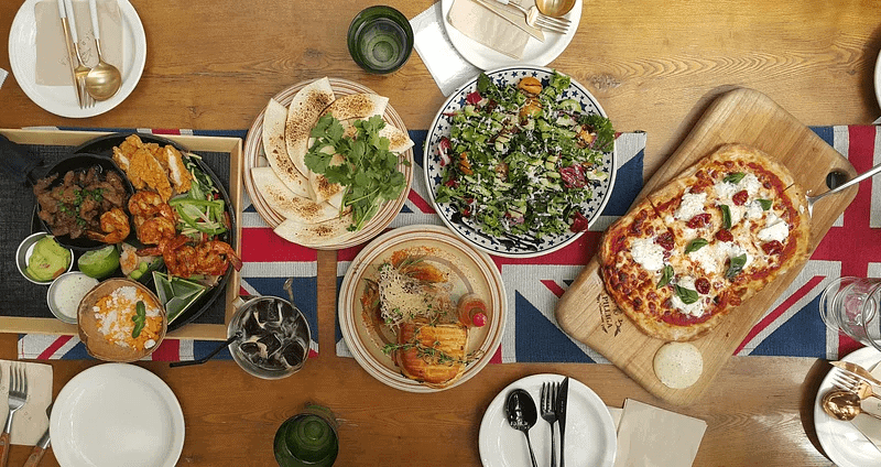 flights to europe - table covered with european food